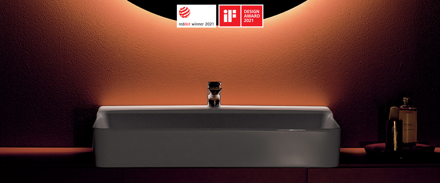 Photo de la collection Conca mise en ambiance montrant une vasque sur meuble suspendu avec un miroir rond au-dessus